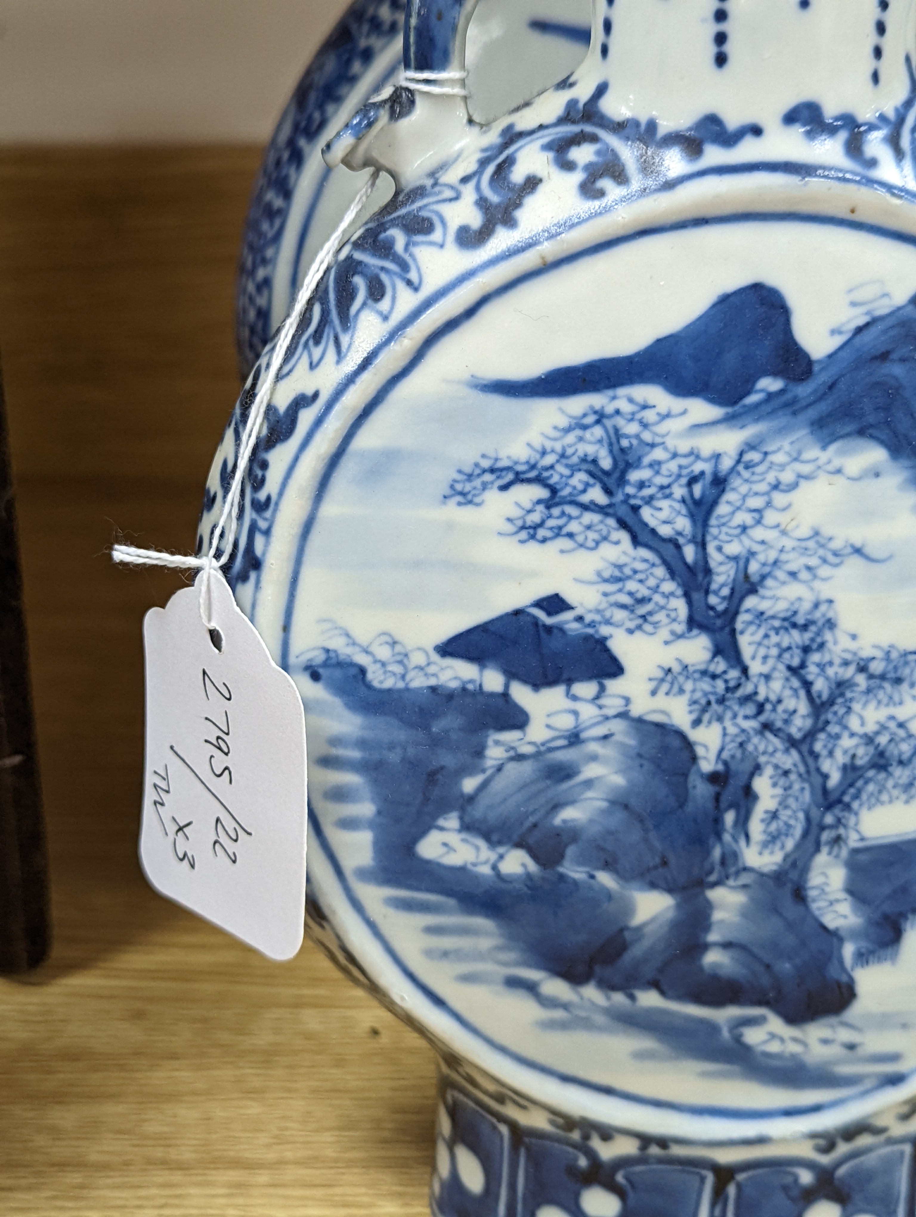 Three 19th century Chinese blue and white Moon flasks, tallest 31 cms.